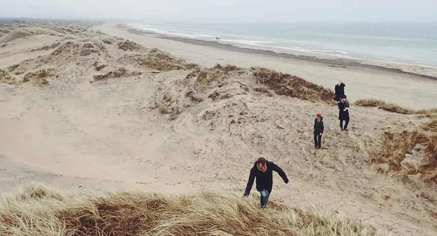 People walking in sand dunes